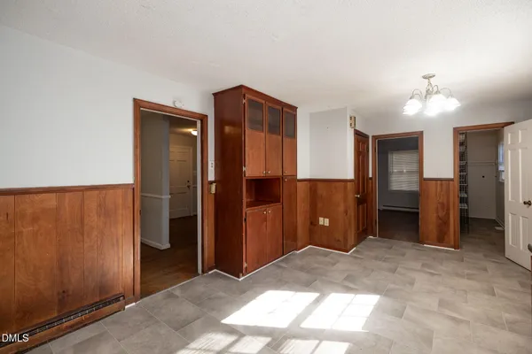 a view of a hallway with a bathroom