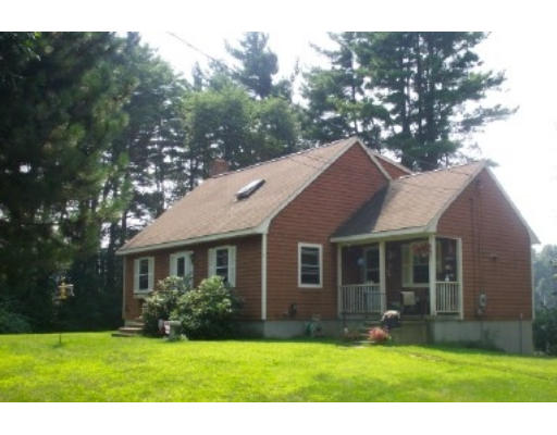 37 Depot Road Hampton Falls, NH 03844 - Photo 1 of 1 a front view of a house with a yard and garage