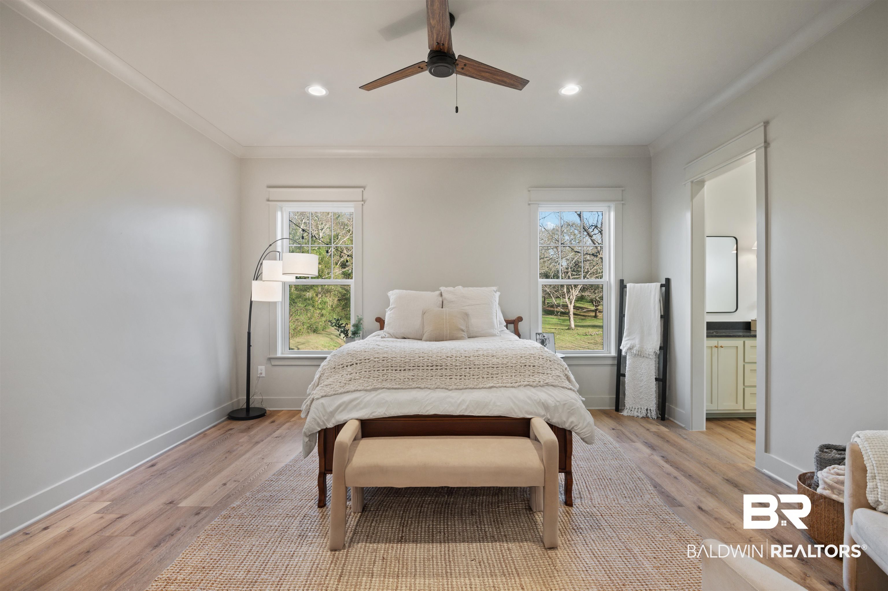 312 Pecan Ridge Boulevard Fairhope, AL 36532 - Photo 23 of 43 Bedroom with ceiling fan, ornamental molding, light hardwood / wood-style floors, and multiple windows
