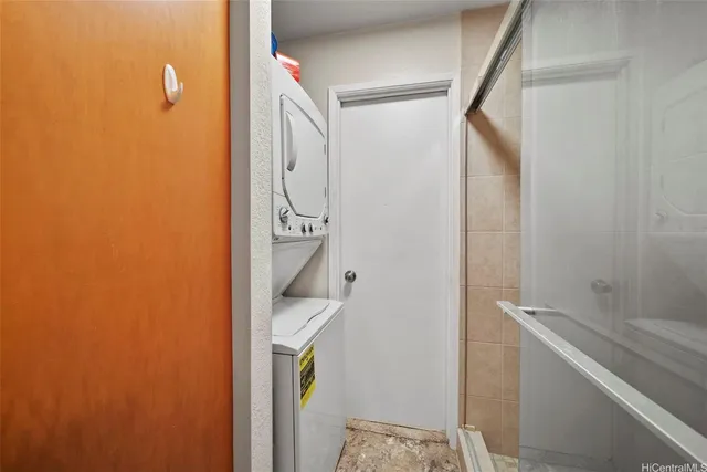 a bathroom with a shower and a sink