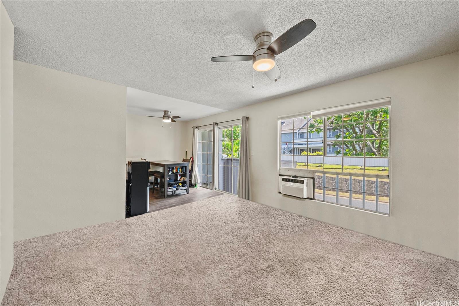 429 Mananai Place, Unit 39U Honolulu, HI 96818 - Photo 2 of 23 a view of a livingroom with furniture and a ceiling fan