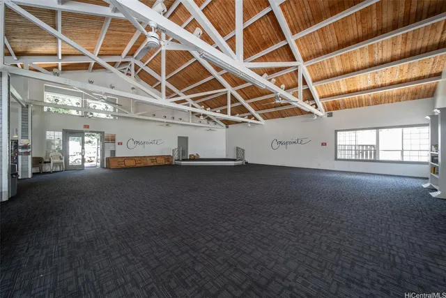a view of empty room with wooden ceiling