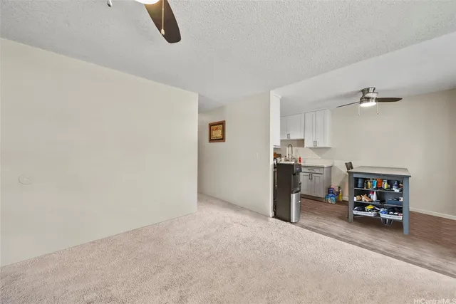 a view of a storage & utility room with two washing machine