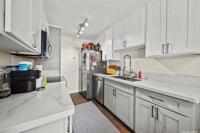 a kitchen with cabinets and appliances