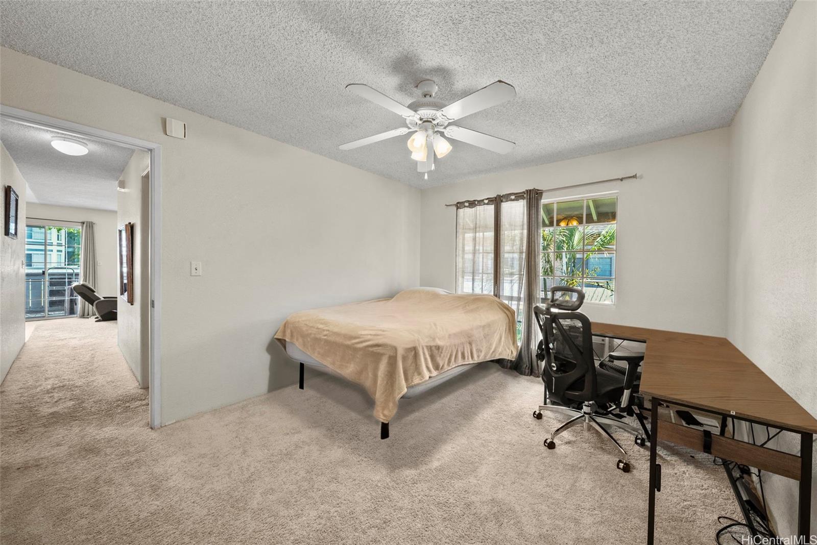 429 Mananai Place, Unit 39U Honolulu, HI 96818 - Photo 10 of 23 a spacious bedroom with a bed and a chandelier