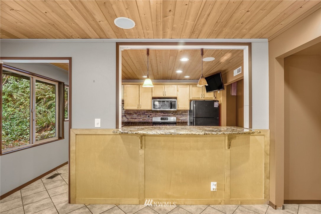 38131 Southeast 91st Street Snoqualmie, WA 98065 - Photo 21 of 40 a view of a kitchen with a window