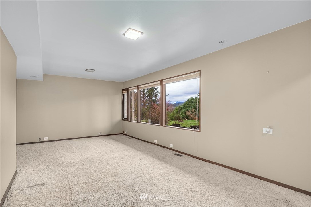 38131 Southeast 91st Street Snoqualmie, WA 98065 - Photo 23 of 40 a view of an empty room with a window
