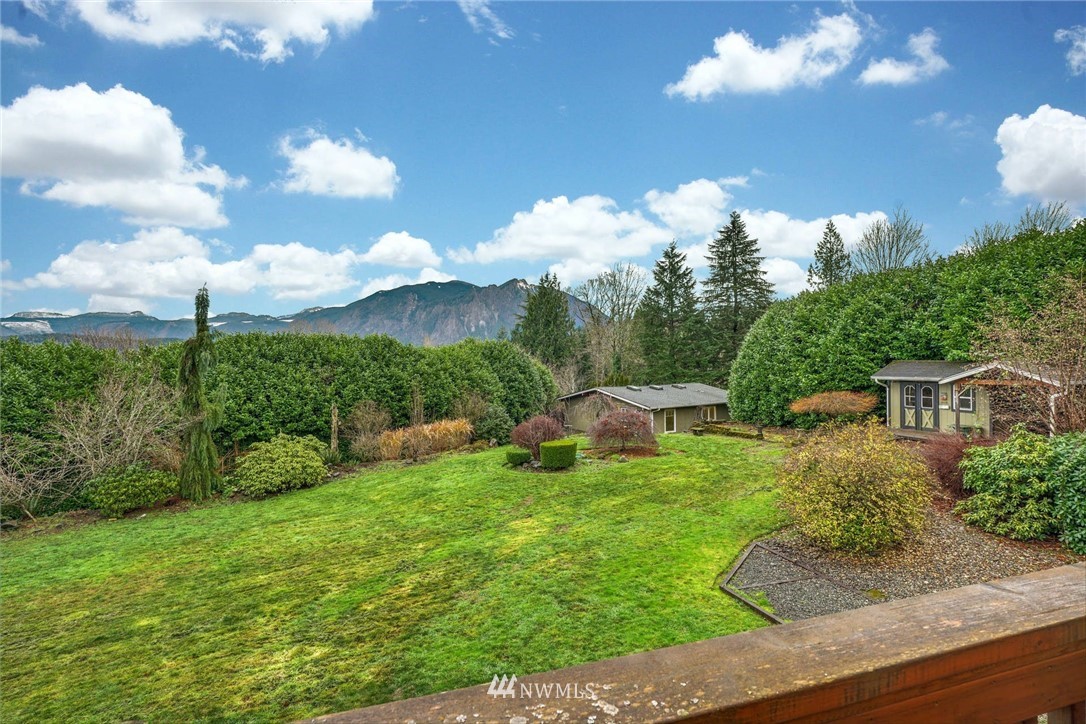 38131 Southeast 91st Street Snoqualmie, WA 98065 - Photo 32 of 40 a view of a fountain in front of a house with a big yard