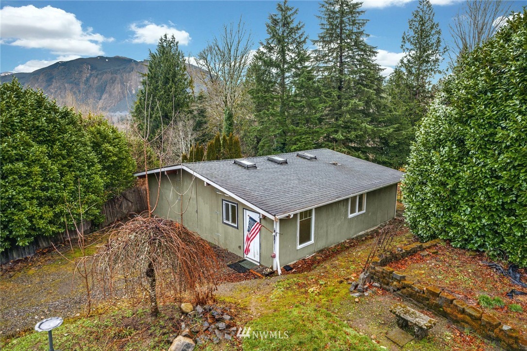 38131 Southeast 91st Street Snoqualmie, WA 98065 - Photo 35 of 40 a aerial view of a house with yard and trees in the background