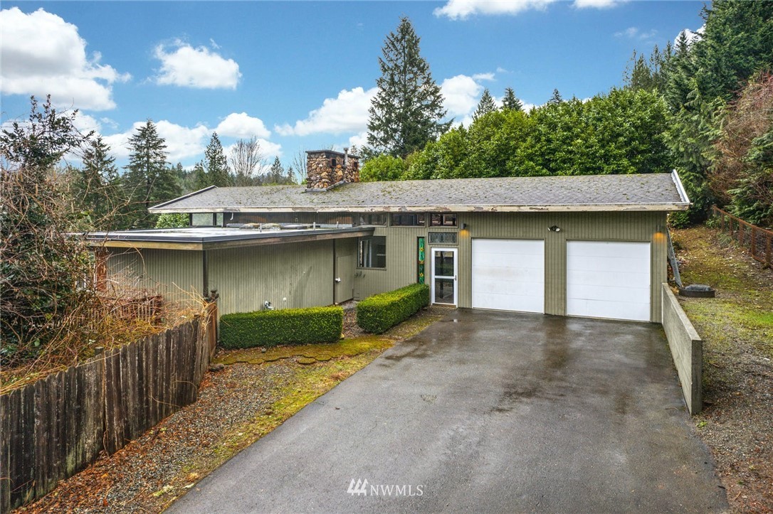 38131 Southeast 91st Street Snoqualmie, WA 98065 - Photo 36 of 40 a view of a house with a tub and a garage