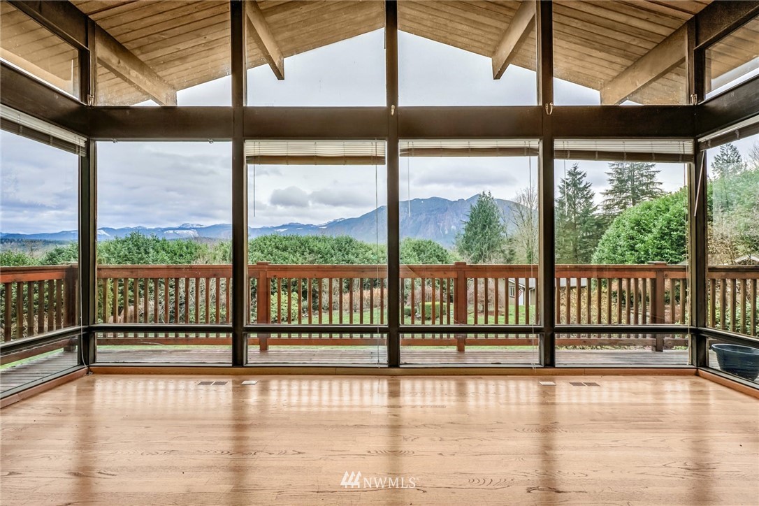 38131 Southeast 91st Street Snoqualmie, WA 98065 - Photo 7 of 40 a view of room with wooden floor and windows