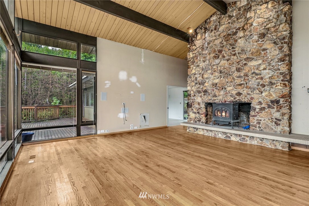 38131 Southeast 91st Street Snoqualmie, WA 98065 - Photo 8 of 40 a view of empty room with wooden floor and fireplace