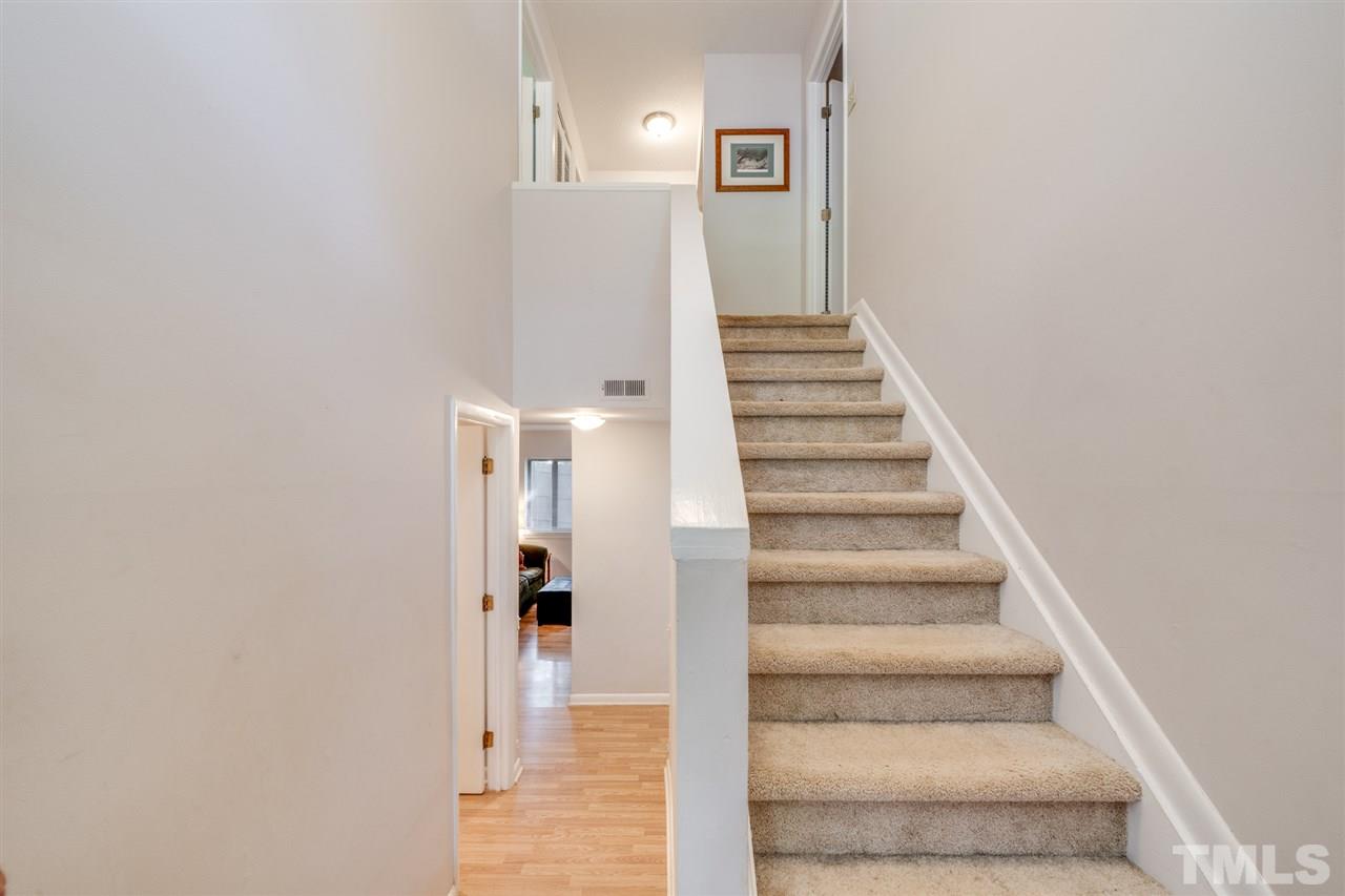 6006 Farm Gate Road Raleigh, NC 27606 - Photo 11 of 21 a view of a hallway with staircase