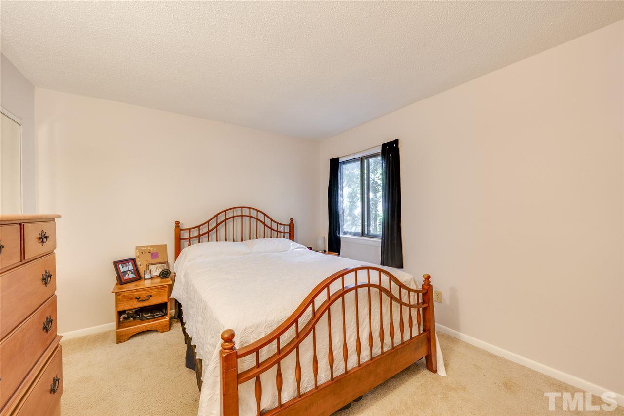 6006 Farm Gate Road Raleigh, NC 27606 - Photo 12 of 21 a bedroom with a bed and a window