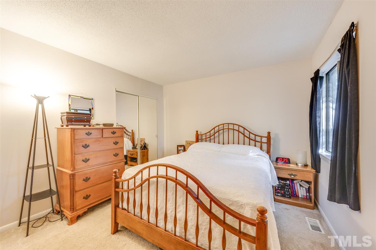 6006 Farm Gate Road Raleigh, NC 27606 - Photo 13 of 21 a bedroom with furniture and a baby crib