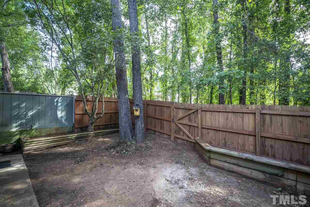 6006 Farm Gate Road Raleigh, NC 27606 - Photo 21 of 21 a backyard of a house