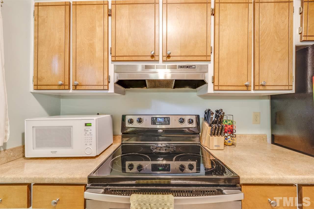6006 Farm Gate Road Raleigh, NC 27606 - Photo 7 of 21 a view of a kitchen with appliances and cabinets