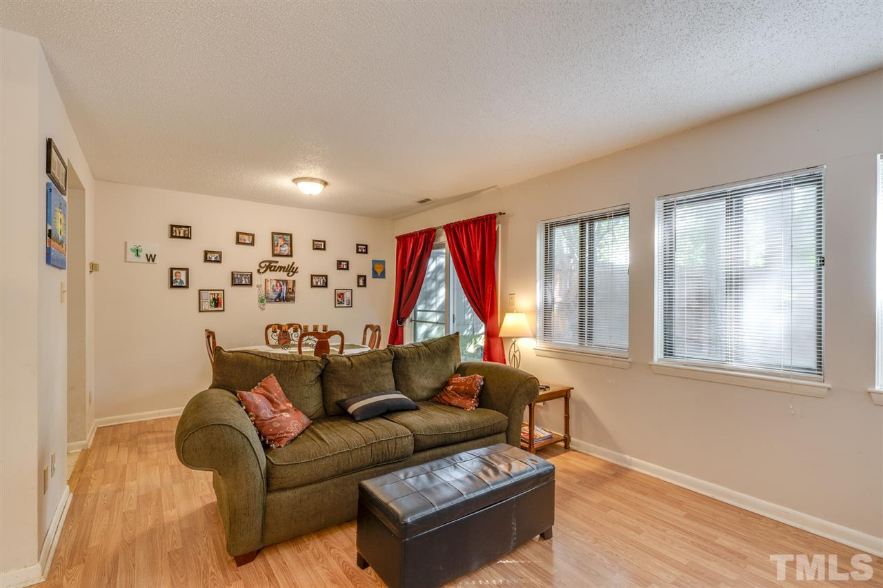 6006 Farm Gate Road Raleigh, NC 27606 - Photo 10 of 21 a living room with furniture and a window