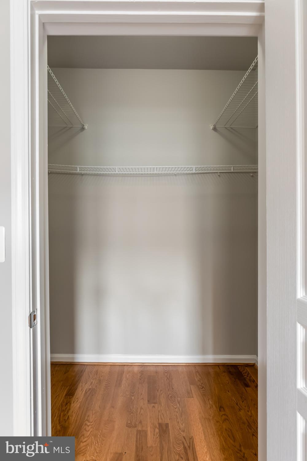12001 Market Street, Unit 217 Reston, VA 20190 - Photo 14 of 38 Walk-in Closet in Primary Bdrm