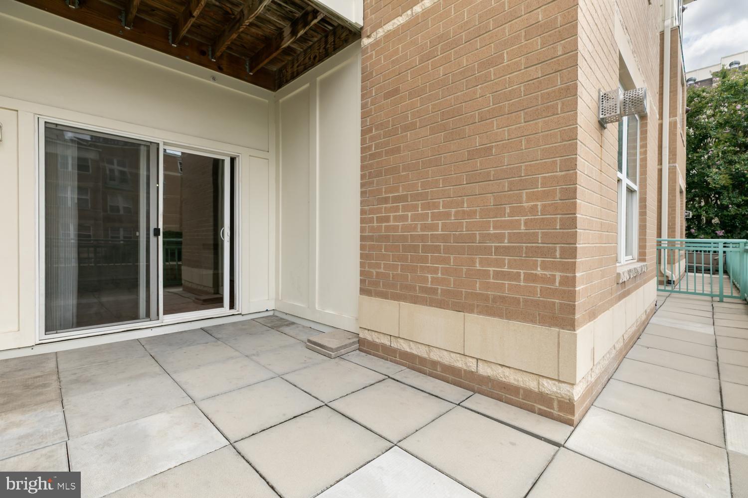 12001 Market Street, Unit 217 Reston, VA 20190 - Photo 21 of 38 Large wrap around balcony overlooking pool