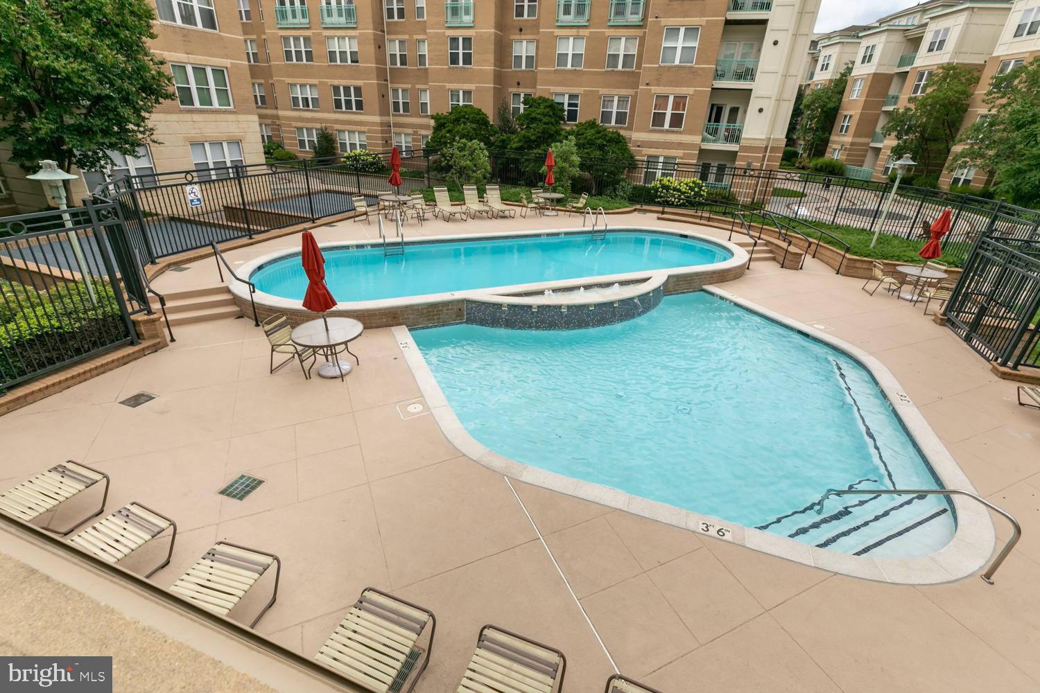12001 Market Street, Unit 217 Reston, VA 20190 - Photo 25 of 38 View of pool from balcony