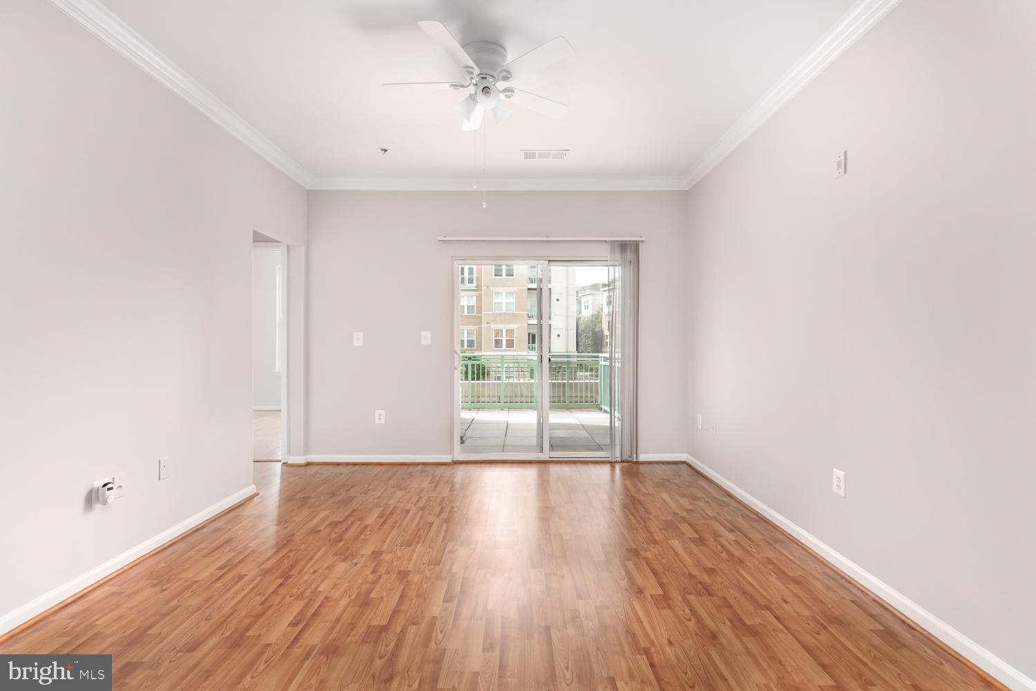 12001 Market Street, Unit 217 Reston, VA 20190 - Photo 5 of 38 Living Room w/exit to wrap around balcony