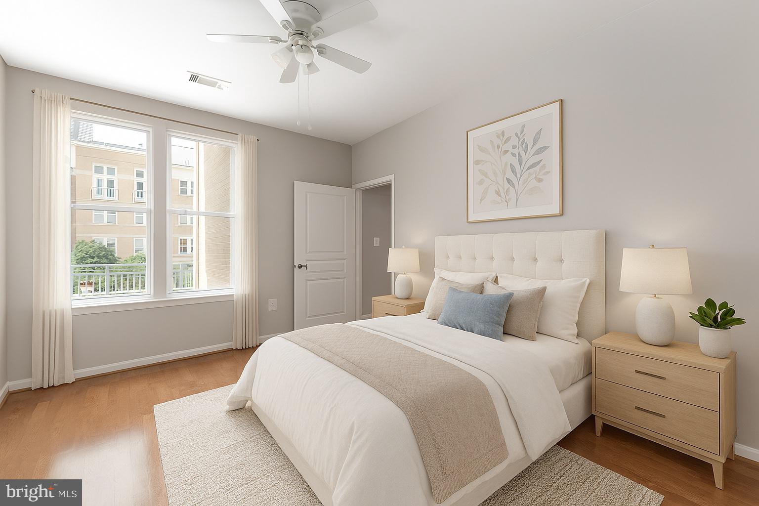 12001 Market Street, Unit 217 Reston, VA 20190 - Photo 9 of 38 Primary Bedroom Virtually Staged