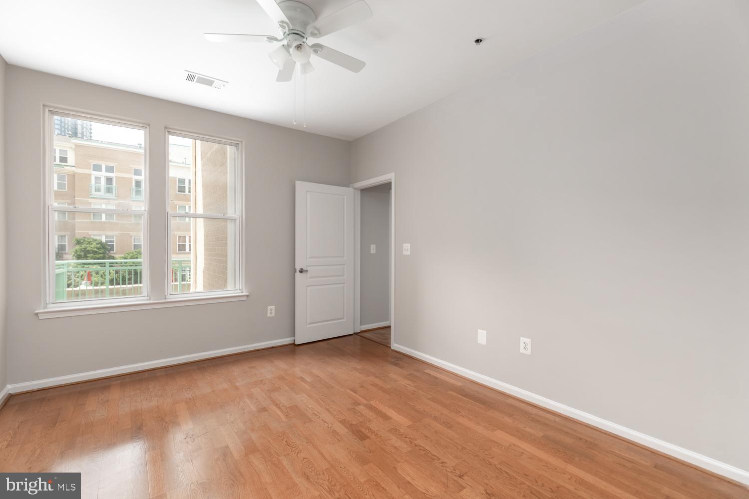 12001 Market Street, Unit 217 Reston, VA 20190 - Photo 10 of 38 Primary Bedroom