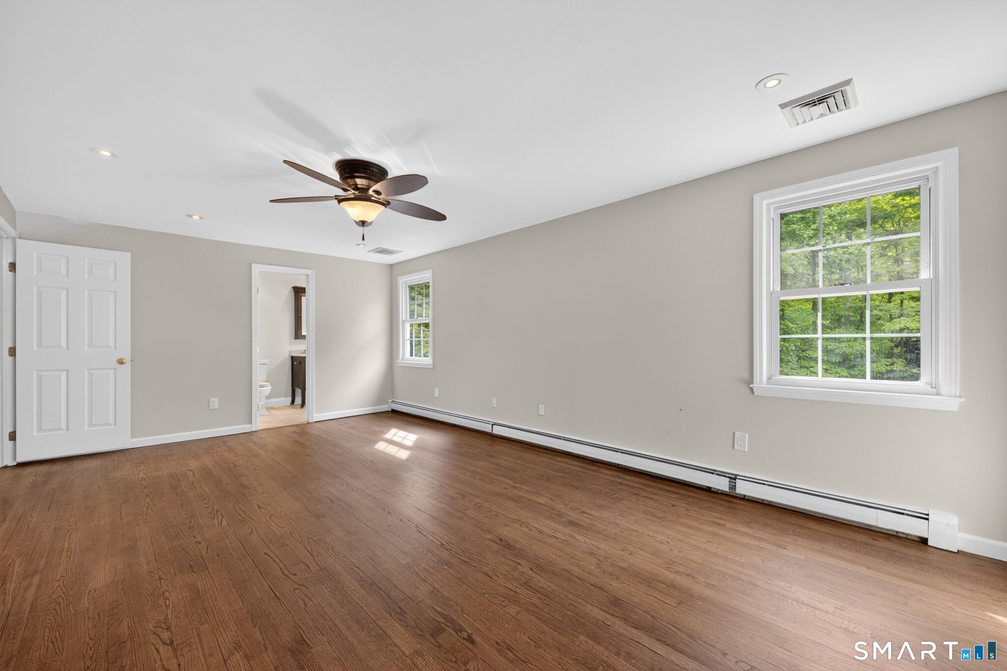 70 Barrack Hill Road Ridgefield, CT 06877 - Photo 13 of 32 an empty room with wooden floor and ceiling fan