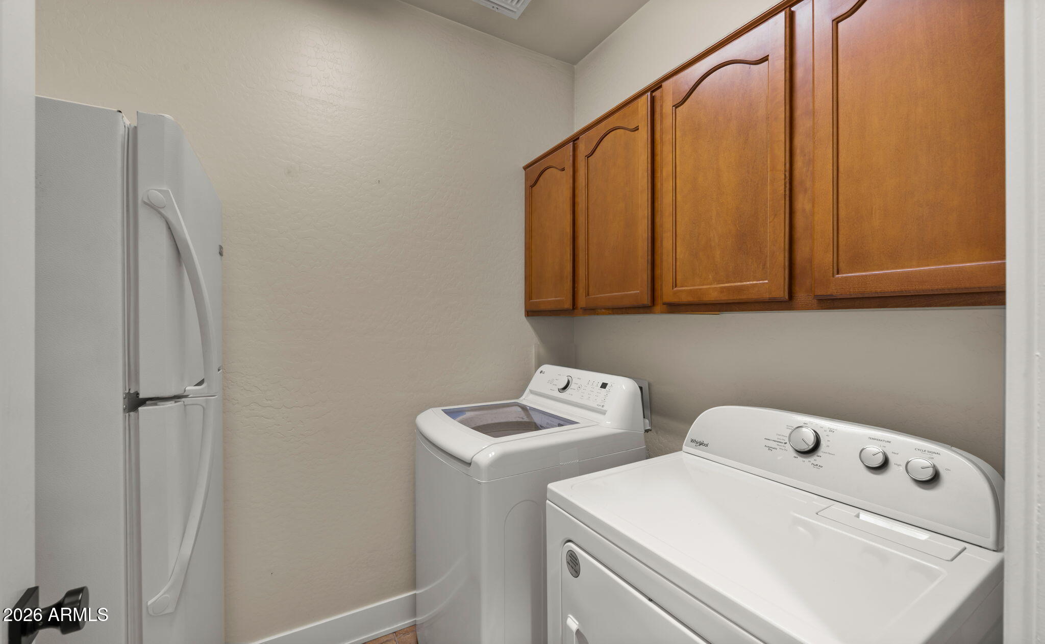 3344 East Hopkins Road Gilbert, AZ 85295 - Photo 20 of 32 a view of storage and utility room with washer and dryer