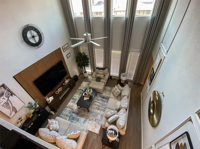 a view of living room with furniture and a flat screen tv