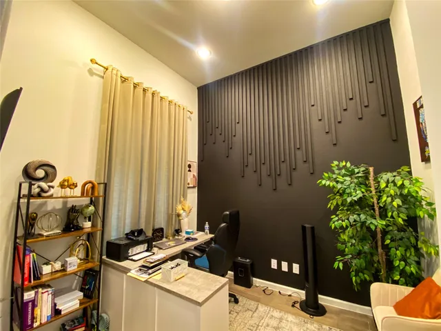 a bathroom with a sink and mirror with shower