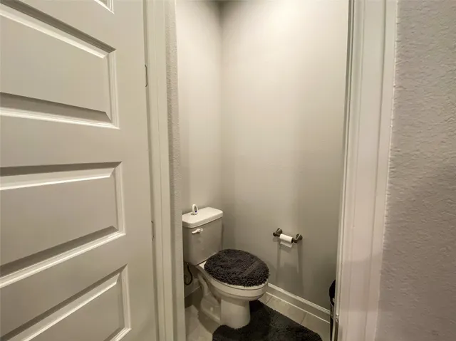 a bathroom with a toilet and a sink