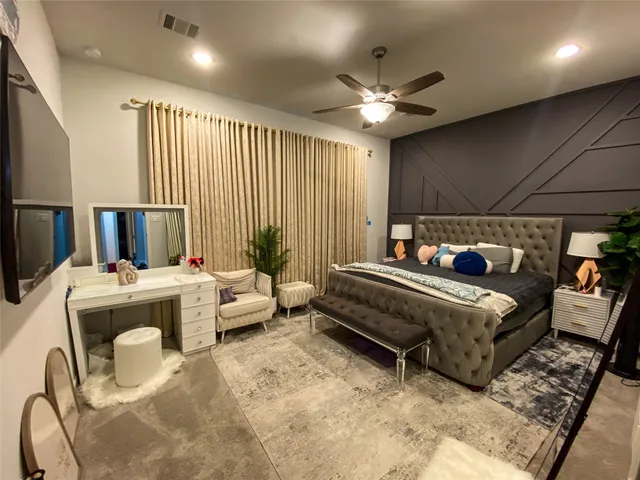 a bed room with a bed and a couch