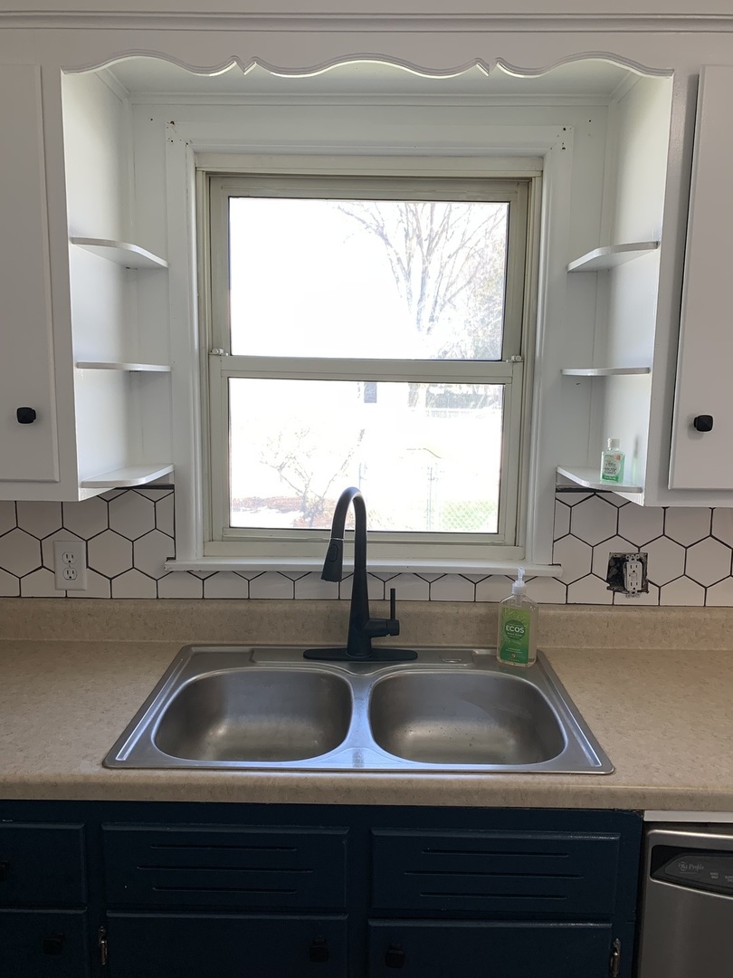 1044 Park Avenue Sycamore, IL 60178 - Photo 12 of 23 a kitchen with a sink and a window