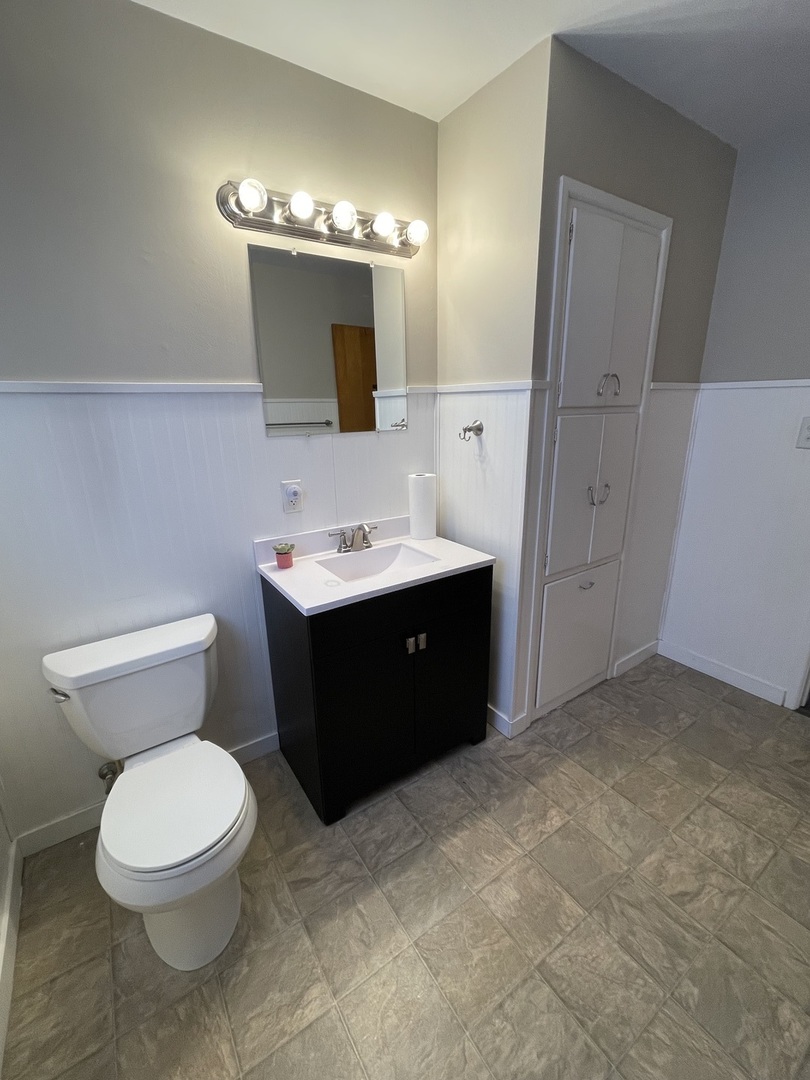 1044 Park Avenue Sycamore, IL 60178 - Photo 16 of 23 a bathroom with a sink a toilet and mirror