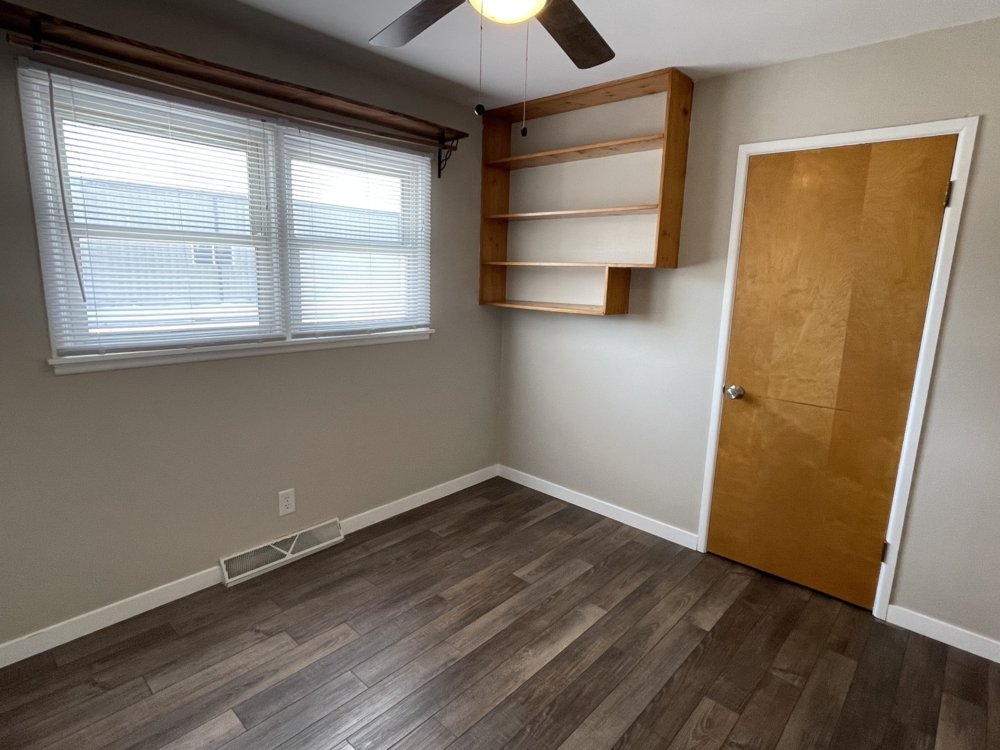 1044 Park Avenue Sycamore, IL 60178 - Photo 17 of 23 an empty room with wooden floor and windows