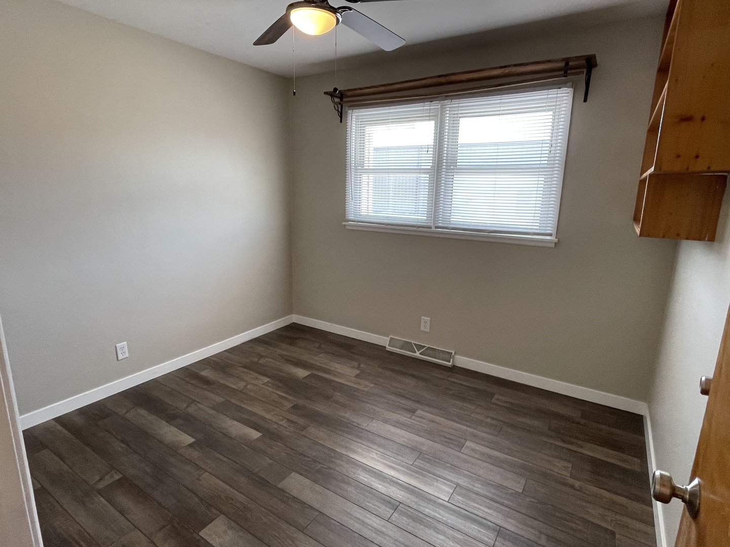 1044 Park Avenue Sycamore, IL 60178 - Photo 18 of 23 an empty room with wooden floor and windows