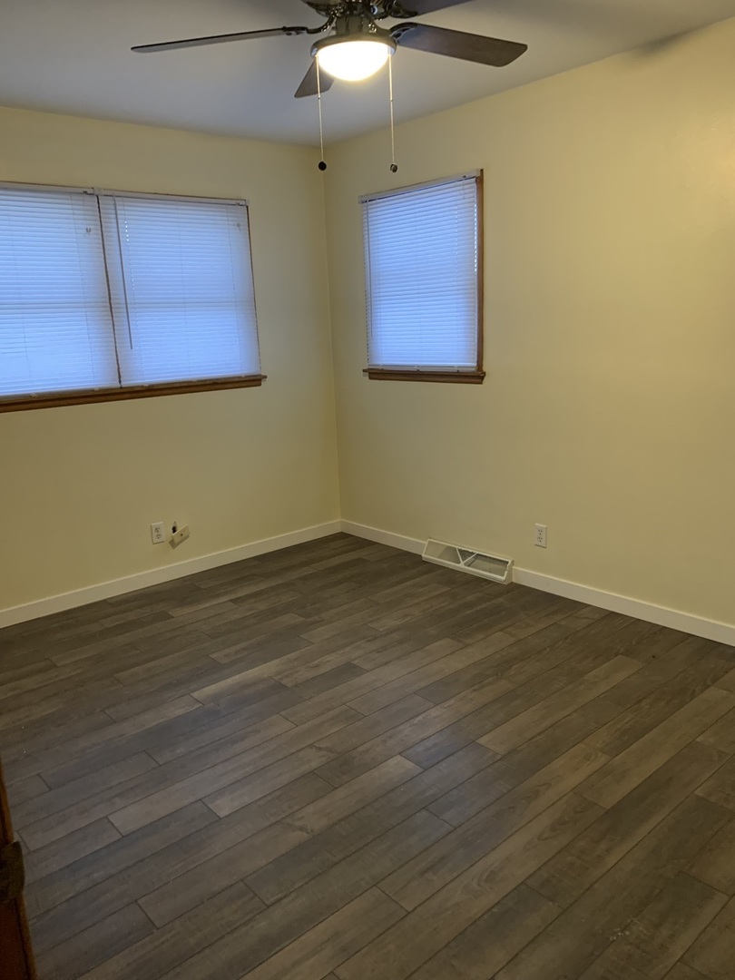 1044 Park Avenue Sycamore, IL 60178 - Photo 20 of 23 a view of a room with wooden floor and cabinet