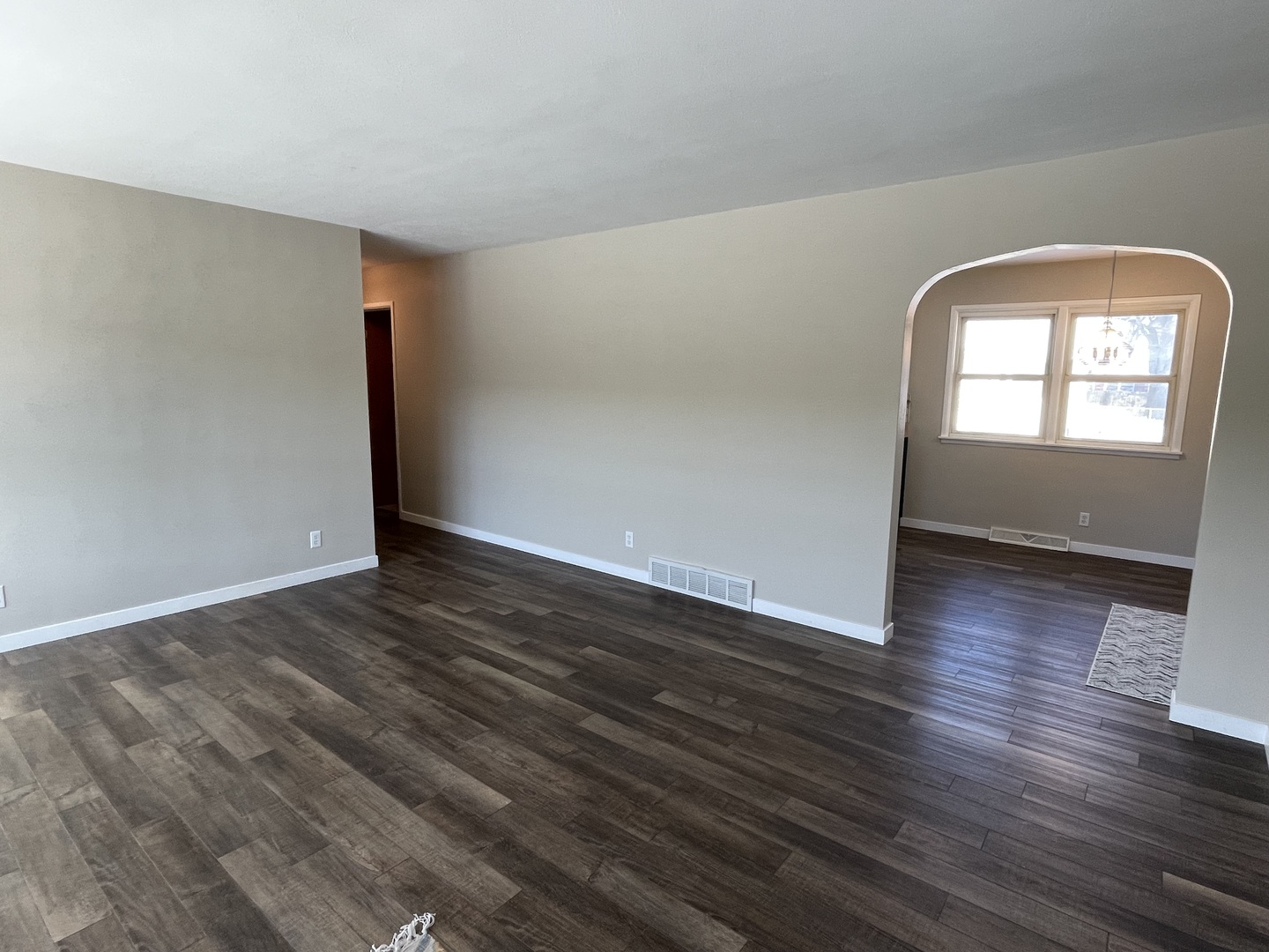 1044 Park Avenue Sycamore, IL 60178 - Photo 2 of 23 an empty room with wooden floor and windows