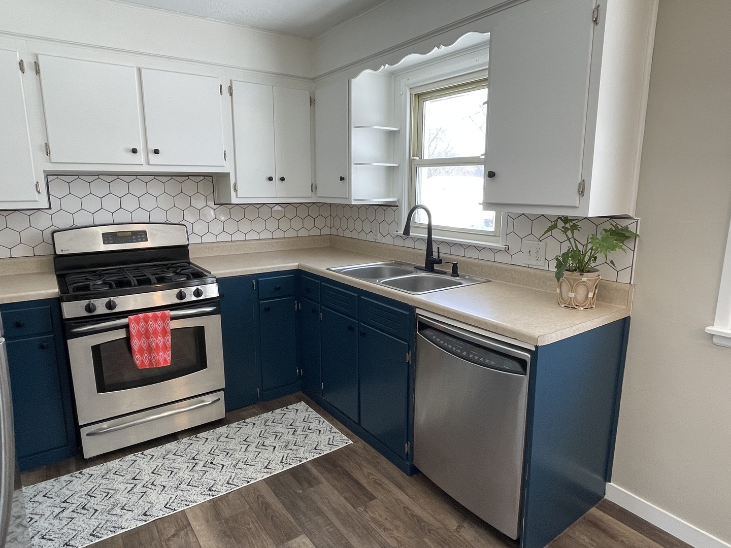 1044 Park Avenue Sycamore, IL 60178 - Photo 8 of 23 a kitchen with a sink stove and cabinets