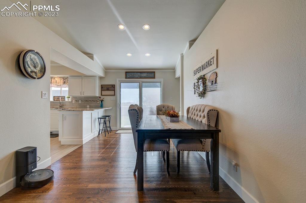 648 South McCulloch Boulevard Pueblo, CO 81007 - Photo 11 of 50 a view of a dining room with furniture and window
