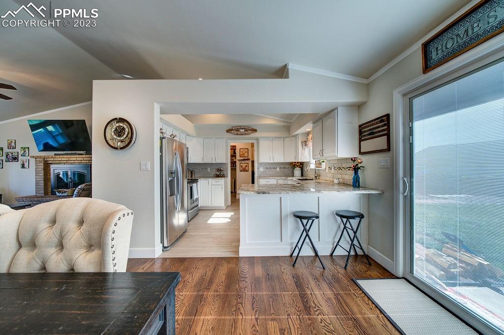648 South McCulloch Boulevard Pueblo, CO 81007 - Photo 12 of 50 a living room with stainless steel appliances furniture a rug and a table