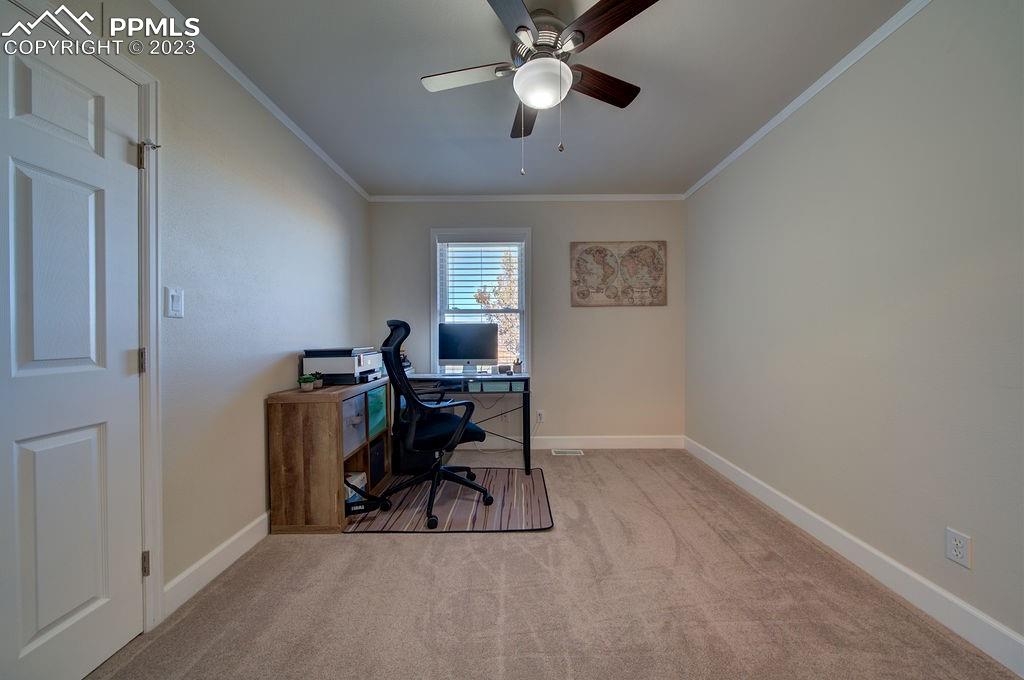 648 South McCulloch Boulevard Pueblo, CO 81007 - Photo 21 of 50 a view of a workspace with furniture and a window