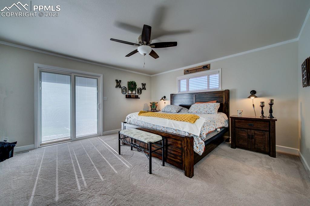 648 South McCulloch Boulevard Pueblo, CO 81007 - Photo 22 of 50 a bed sitting in a spacious bedroom next to a window