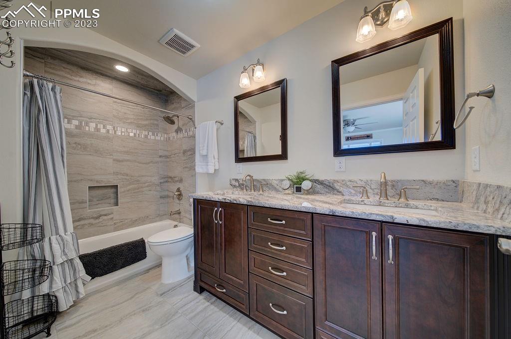 648 South McCulloch Boulevard Pueblo, CO 81007 - Photo 24 of 50 a bathroom with double vanity sink and two mirror