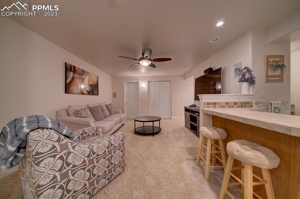 648 South McCulloch Boulevard Pueblo, CO 81007 - Photo 34 of 50 a living room with furniture and a flat screen tv