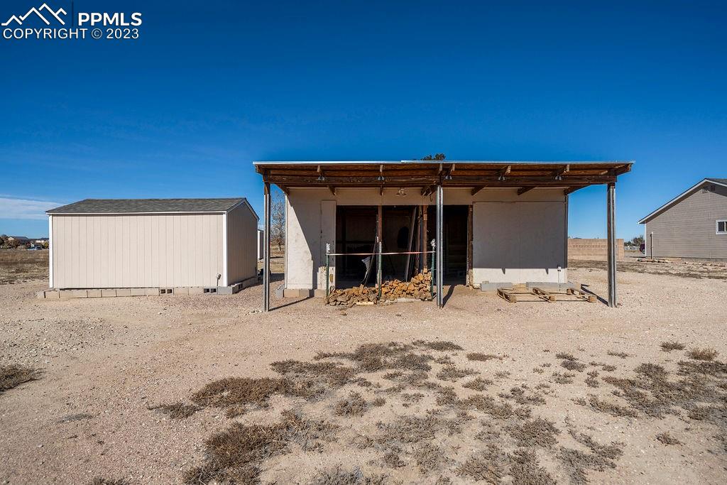648 South McCulloch Boulevard Pueblo, CO 81007 - Photo 45 of 50 a view of a house with a yard