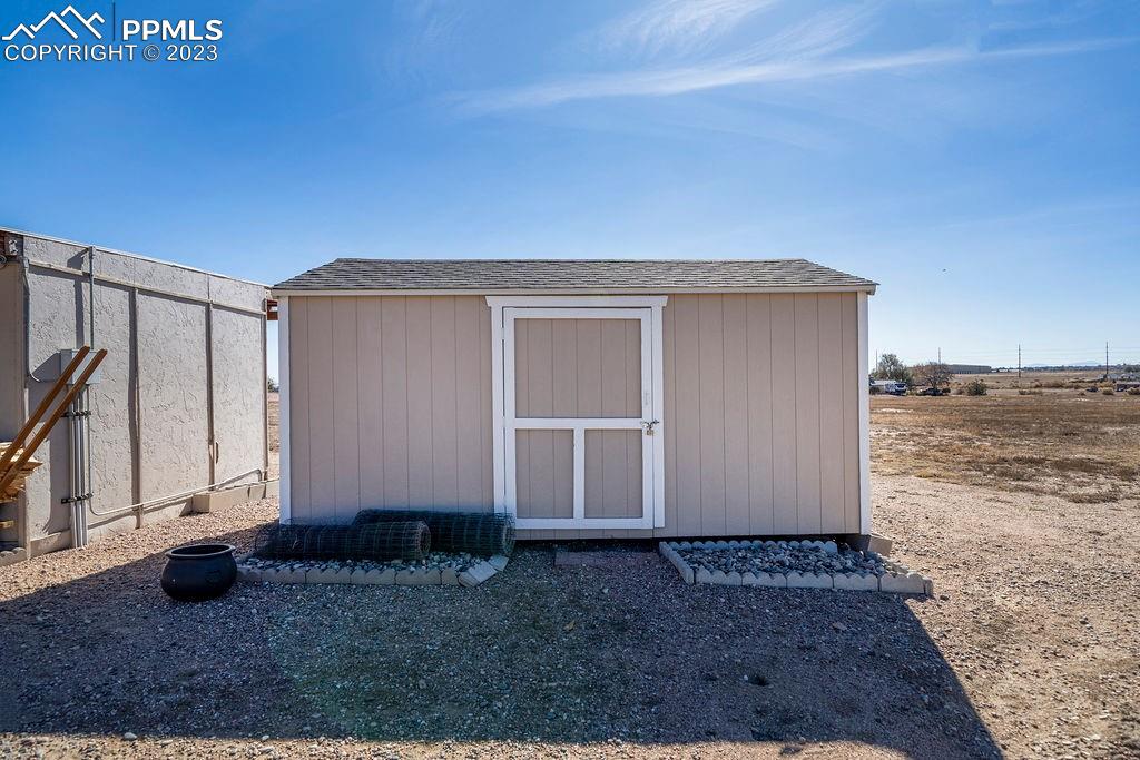 648 South McCulloch Boulevard Pueblo, CO 81007 - Photo 46 of 50 a view of a house with backyard