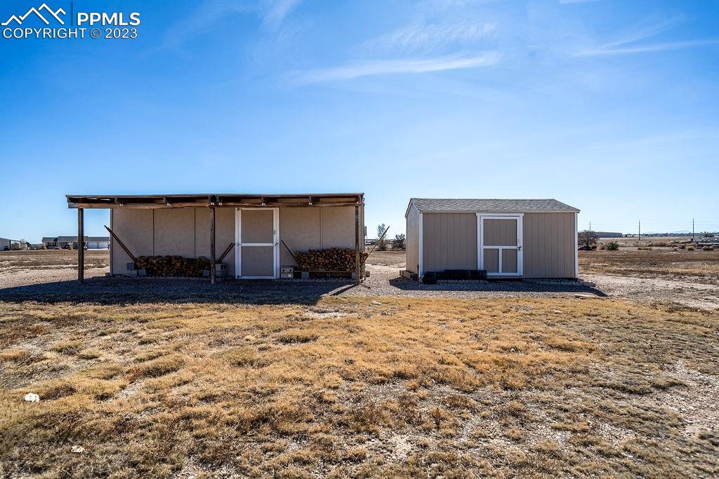 648 South McCulloch Boulevard Pueblo, CO 81007 - Photo 47 of 50 a view of a house with a yard